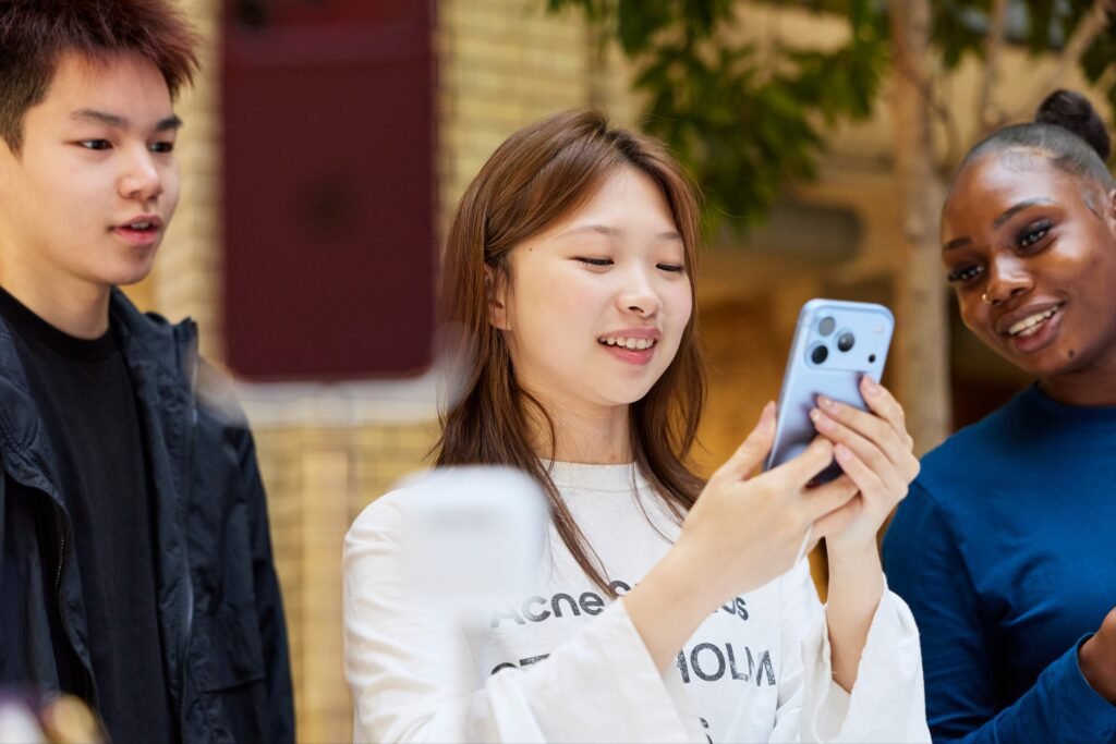A customer tries the iPhone 18 Pro at Apple Covent Garden in London on launch day.