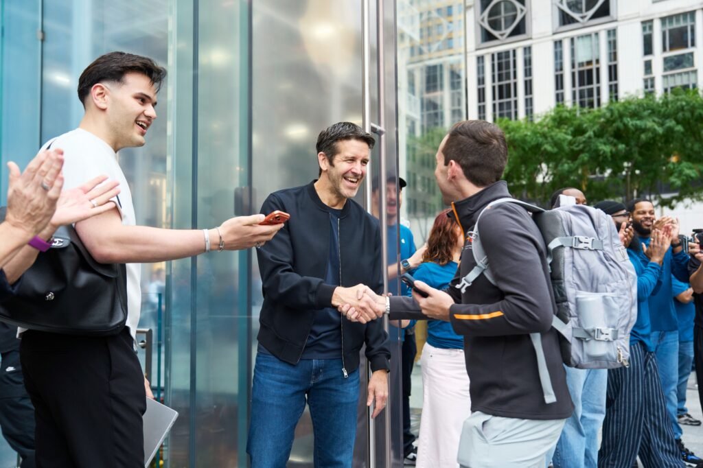 John Ternus greets a customer at Apple Fifth Avenue in New York on September 18, launch day for the iPhone 18 Pro, Apple Watch and AirPods 5.