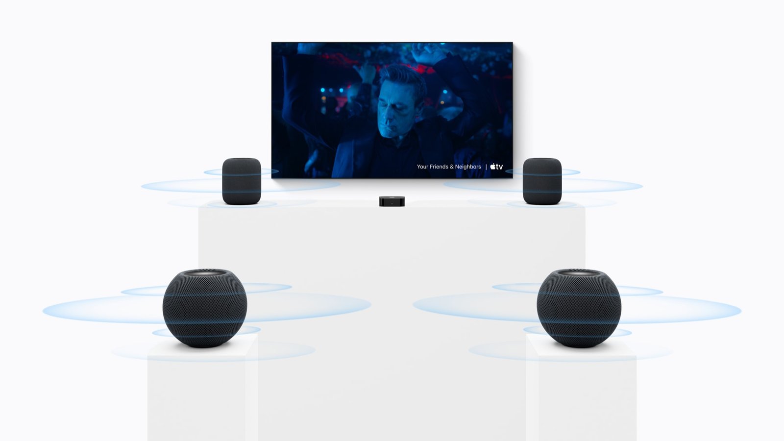 A home theatre with two HomePod (2nd generation) speakers in front and two HomePod mini 2 speakers at the rear