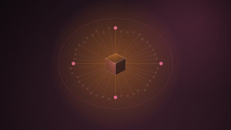 Abstract illustration of a ring of small orange nodes inside a closed oval boundary, with lines converging on an isometric cube at the centre, on a dark burgundy background.
