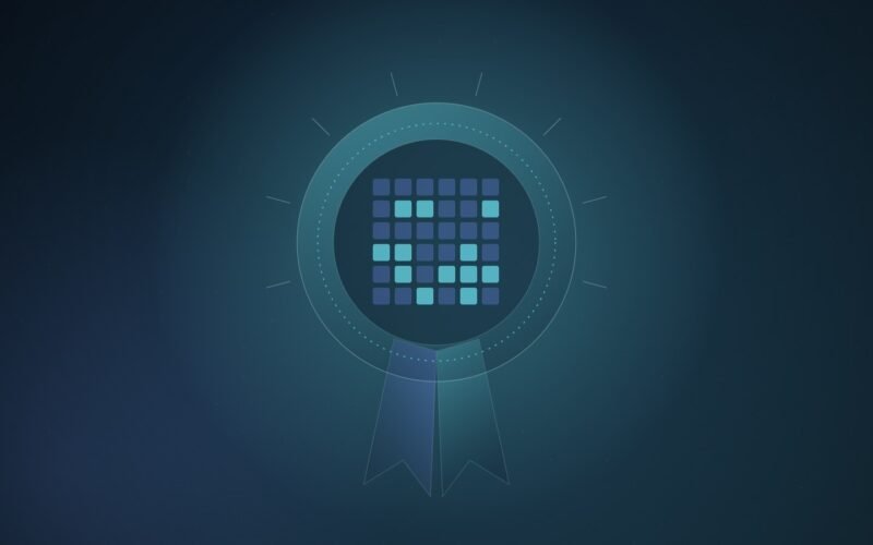 Abstract illustration of a round medal with ribbon tails whose centre is a grid of glowing chip cores, on a deep teal gradient
